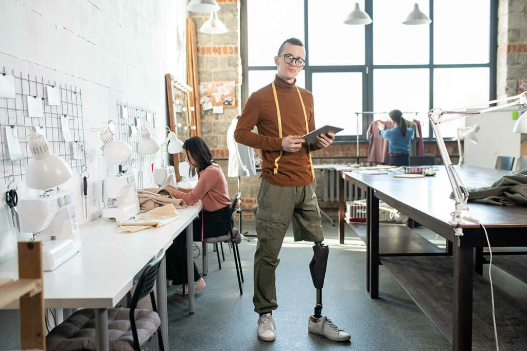 An above the knee amputated person working in the fashion industry