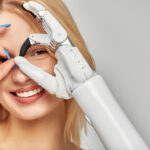 Smiling happy woman with an advanced arm and hand prosthesis looking at camera