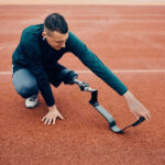 Getting ready for a run using a prosthetic leg and running blade