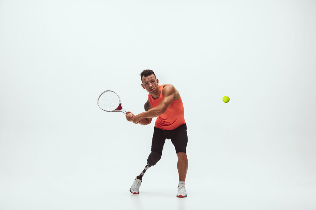 Disabled athlete white background tennis player