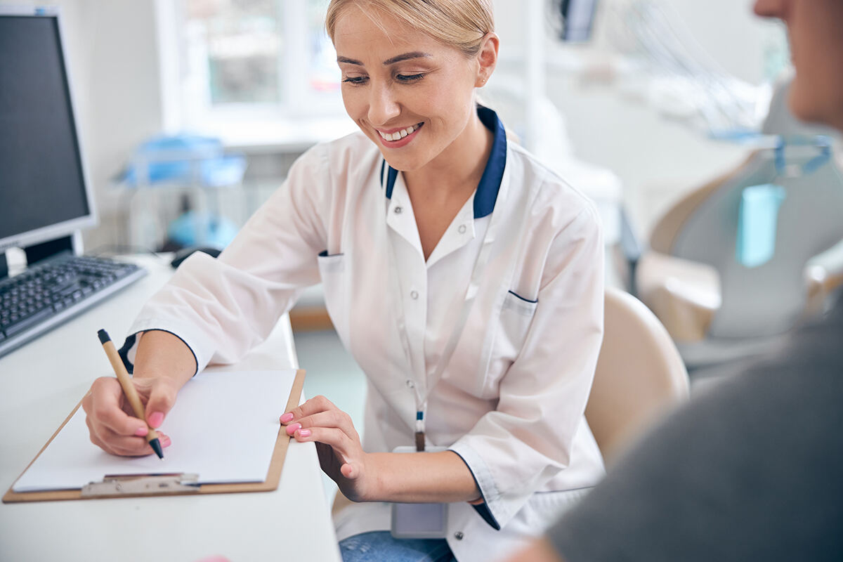 Female doctor talking with a patient