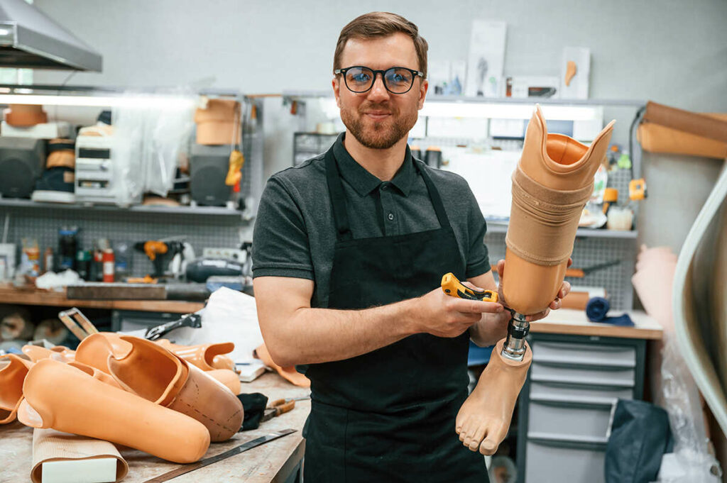 Technician working on a below the knee prosthetic leg