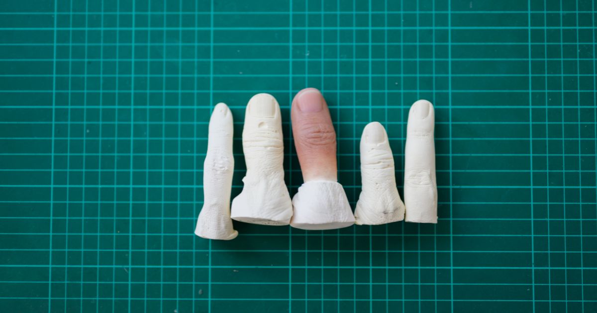 5 different prosthetic silicone fingers in different processes showing the process of creating prosthetic fingers