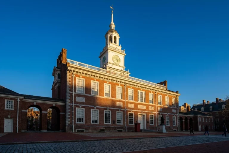 Independence Hall in Philadelphia with its white wooden bell tower in late afternoon golden hour light, representing Pennsylvania amputation injury cases